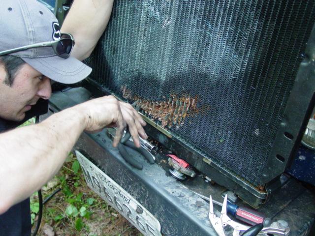 Anthony works on fins of leaking radiator - Click to Enlarge