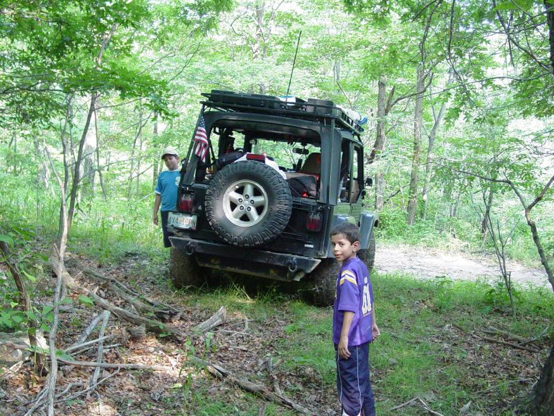 Kids Near Jeep at Scattered Remains