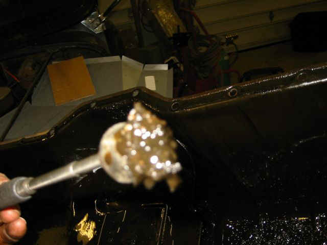 Fuzzy Mechanic photo of Magnetic particles fished from oil pan
