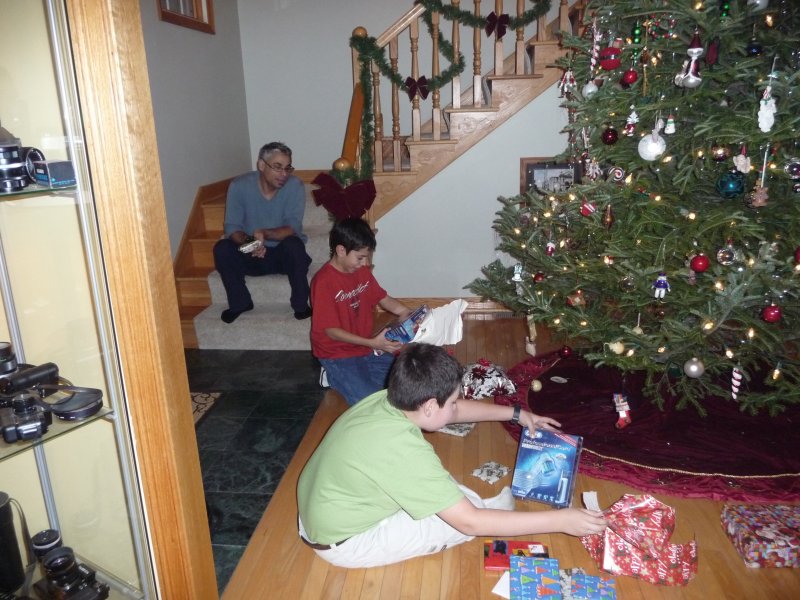 Opening presents on Christmas Eve