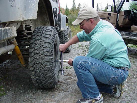 Carl changing a flat tire