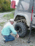 Carl changing a flat tire