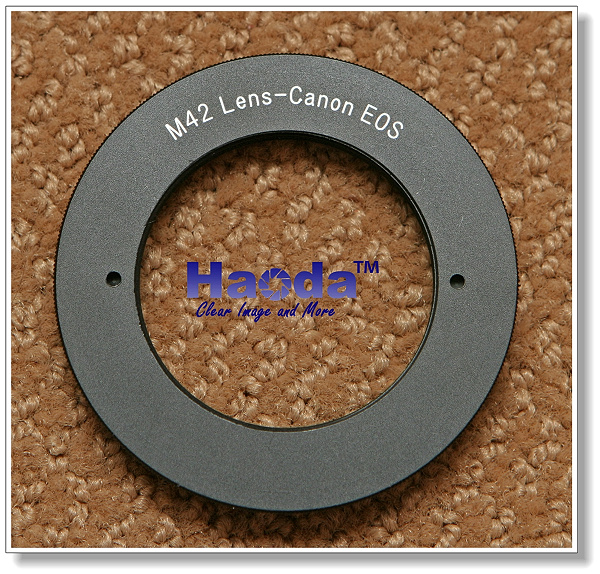 Haoda M-42 to Canon EOS electronic mount adapter with autofocus confirmation.