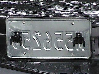 fabricated License Plate holder with Mag Lite clips and spare plate